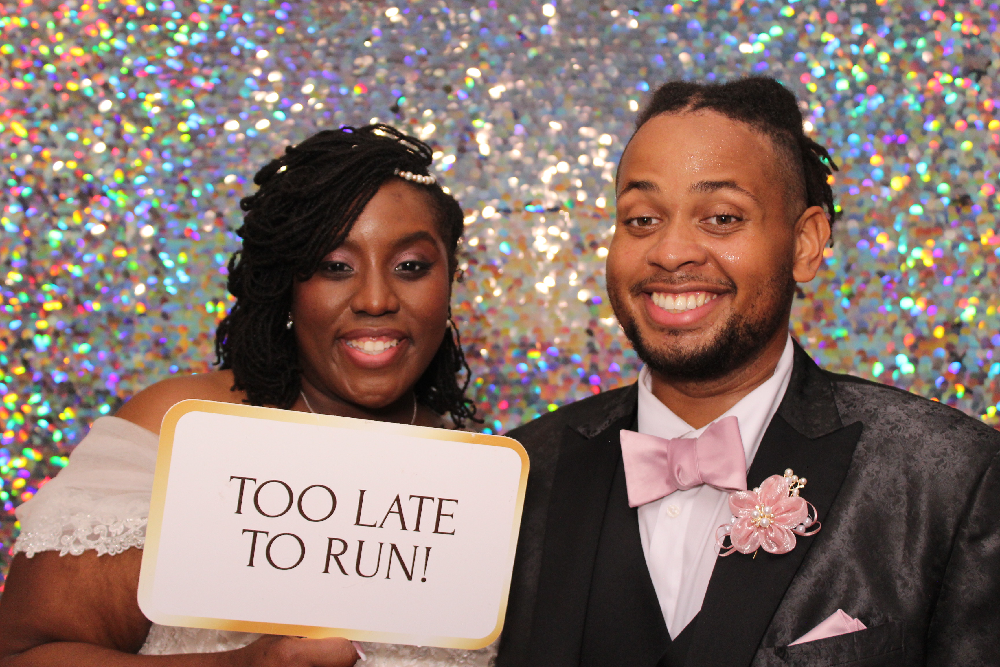 Guests posing with themed photo booth props